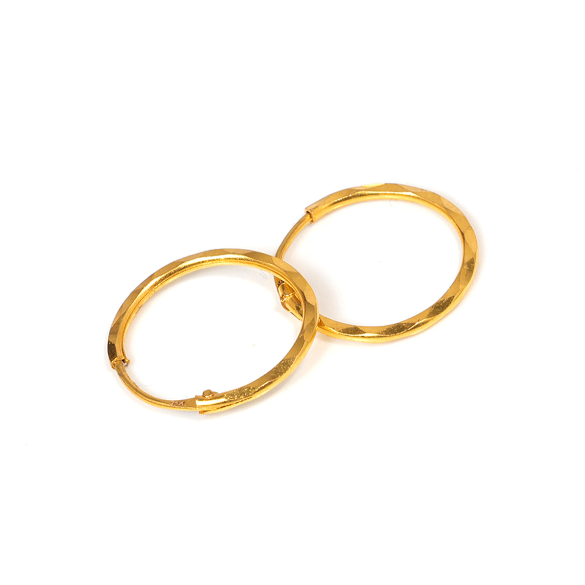 Gold hoop earrings on a white background