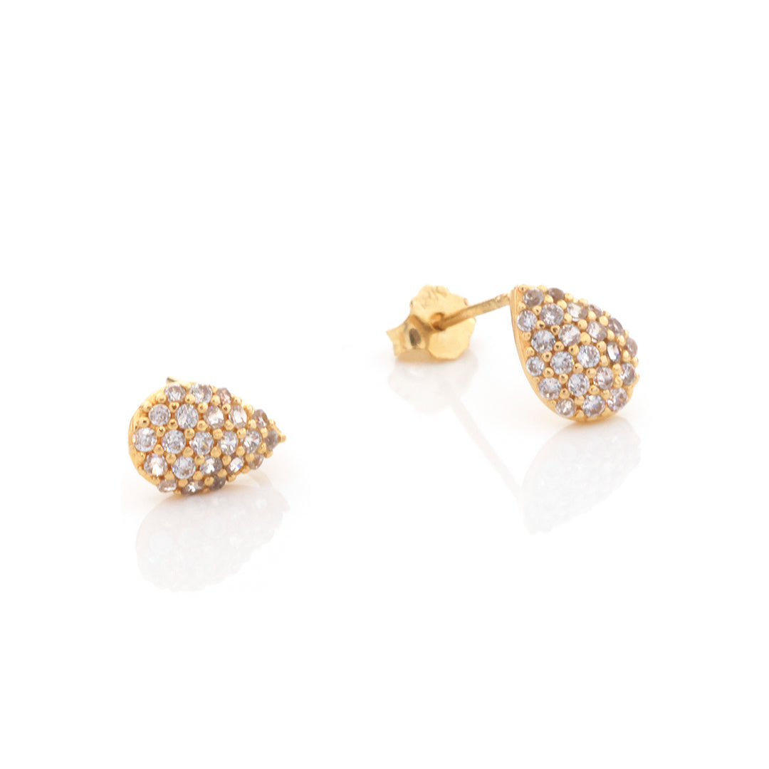A pair of gold teardrop-shaped stud earrings paved with small clear stones, shown on a clean white background with one earring facing forward and the other angled to show the post and backing.
