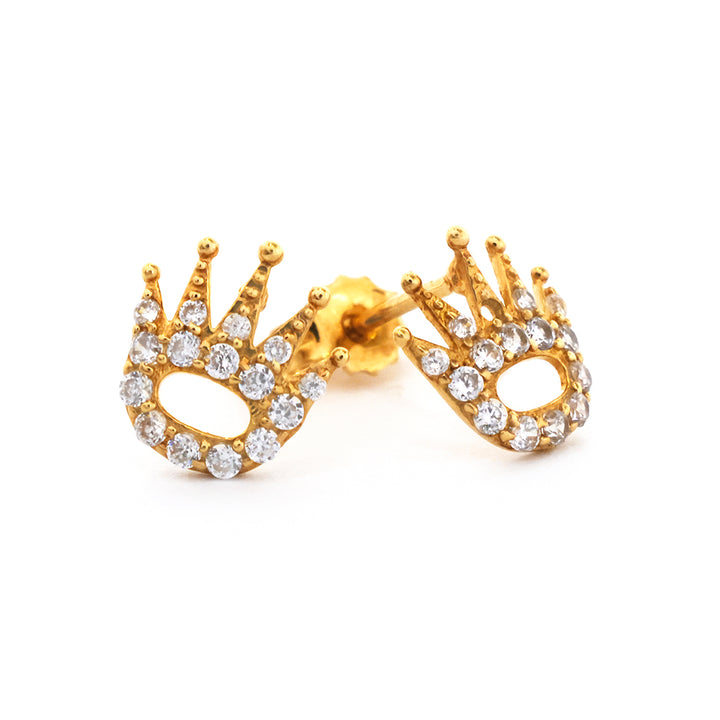 Gold crown-shaped earrings with clear gemstones on a white background