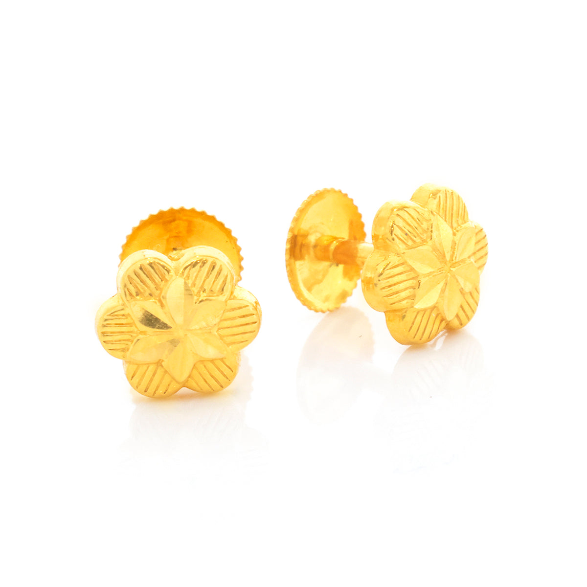 Pair of gold flower-shaped earrings on a white background