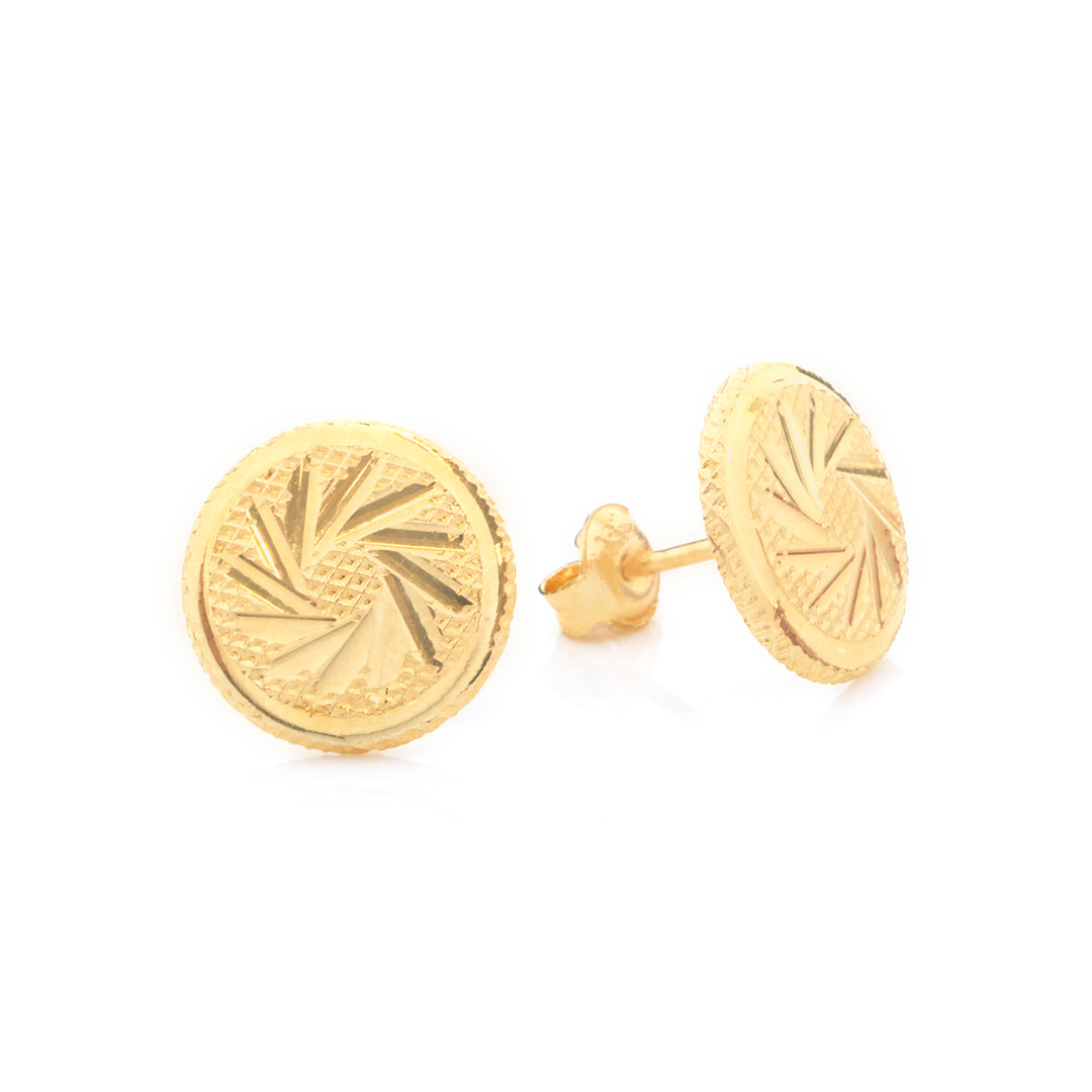 A pair of round gold stud earrings with a textured sunburst pattern, shown on a clean white background.