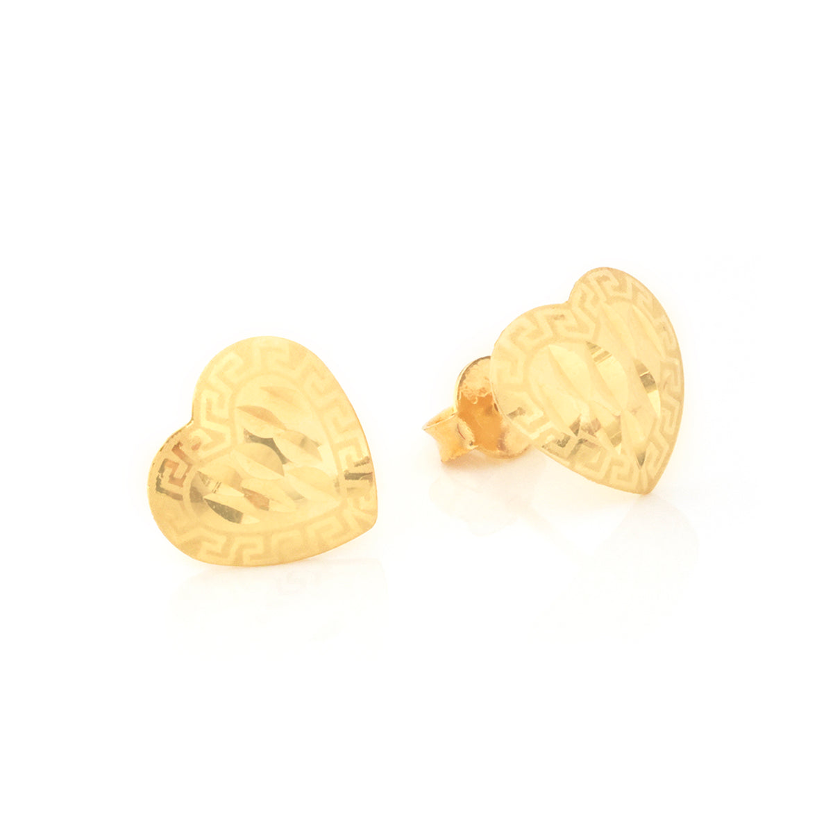 A pair of gold heart-shaped stud earrings with a Greek key pattern border and a textured center, shown on a clean white background.