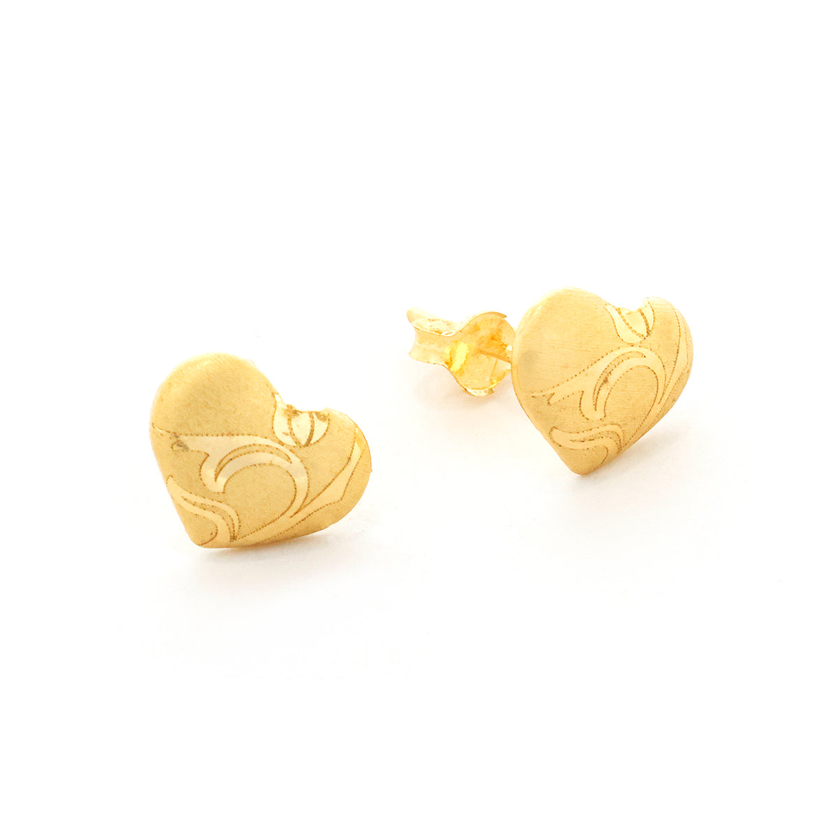 Gold heart-shaped earrings on a white background