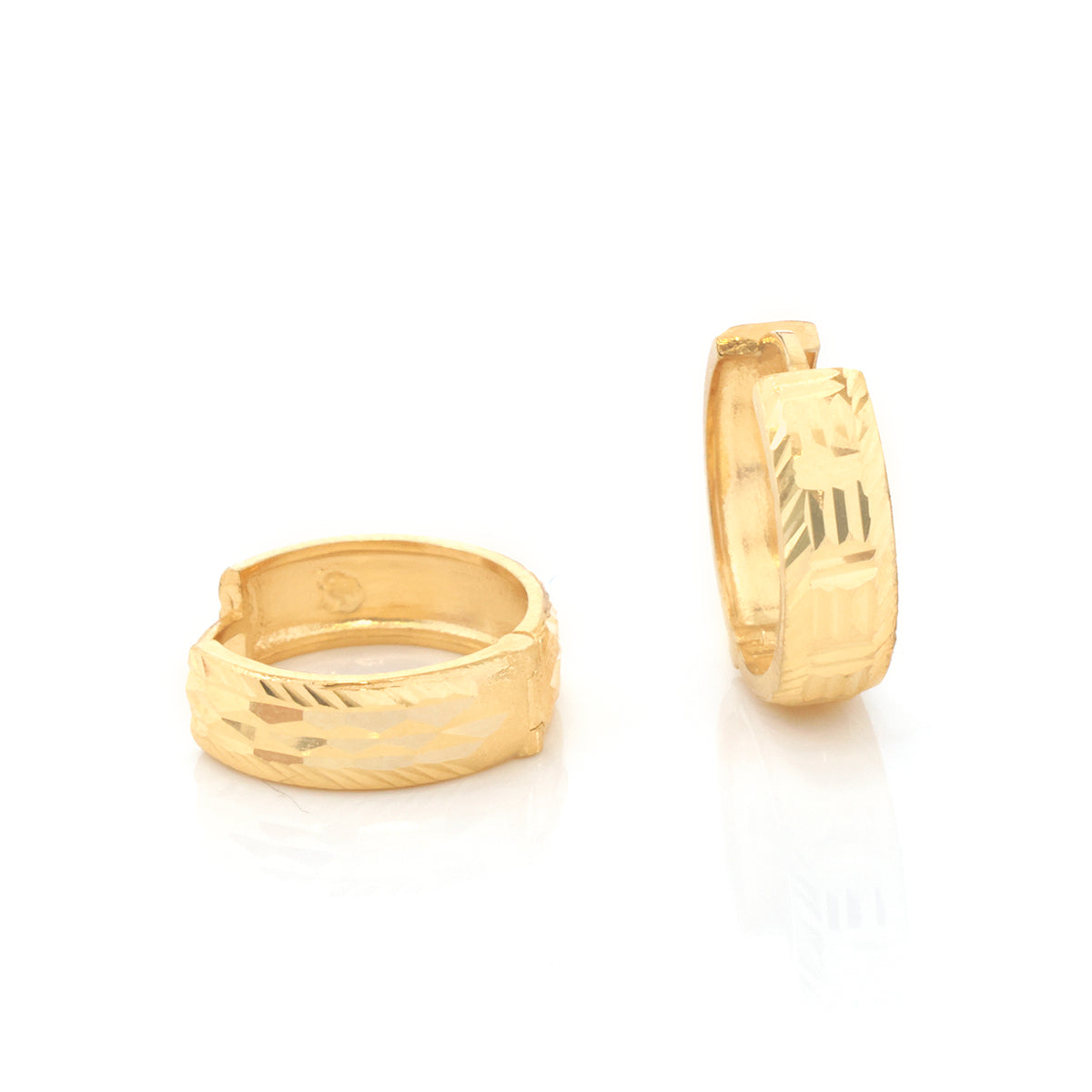 A pair of textured gold huggie hoop earrings shown from two angles on a clean white background.
