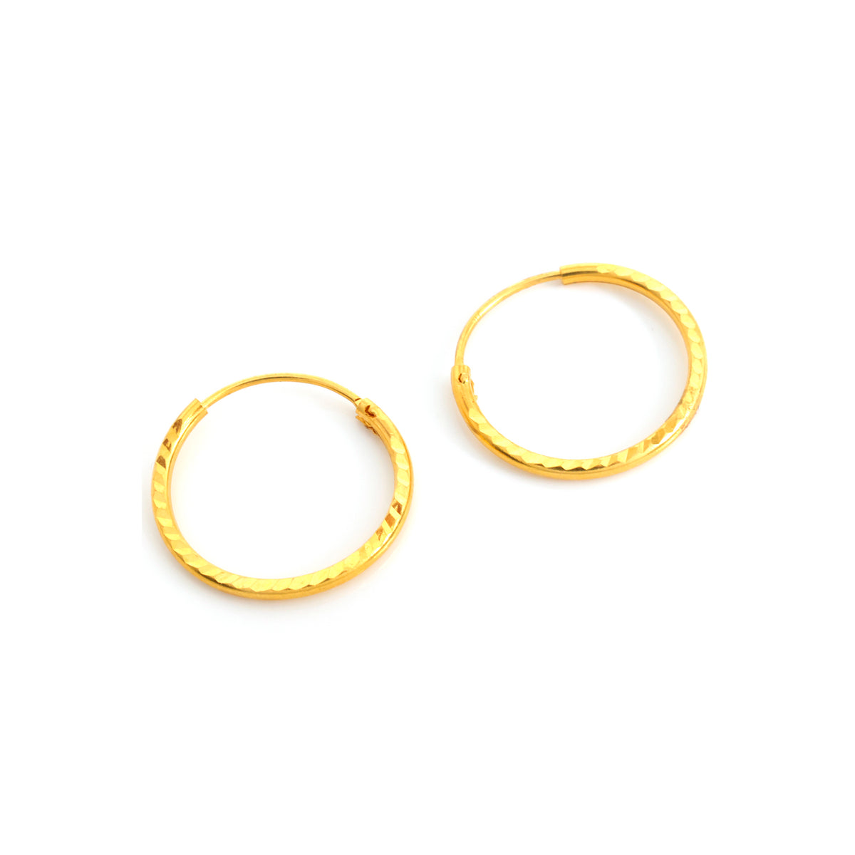 Gold hoop earrings on a white background