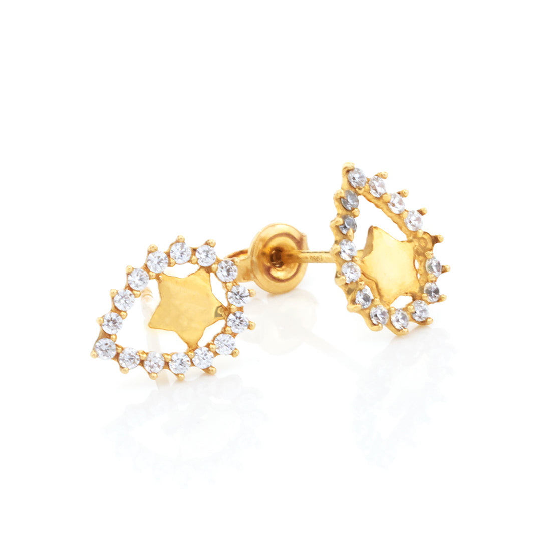 A pair of gold crescent moon stud earrings, each featuring a central star-shaped inlay surrounded by a halo of clear cubic zirconia stones, shown on a white reflective background.