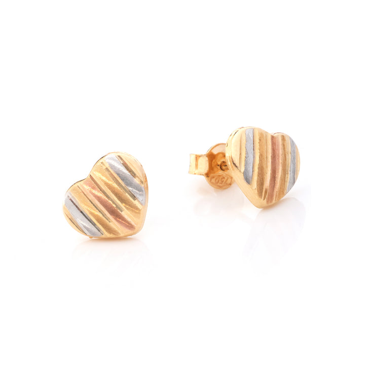 A pair of gold heart-shaped stud earrings with diagonal striped patterns in yellow, silver, and rose gold, shown on a clean white background.