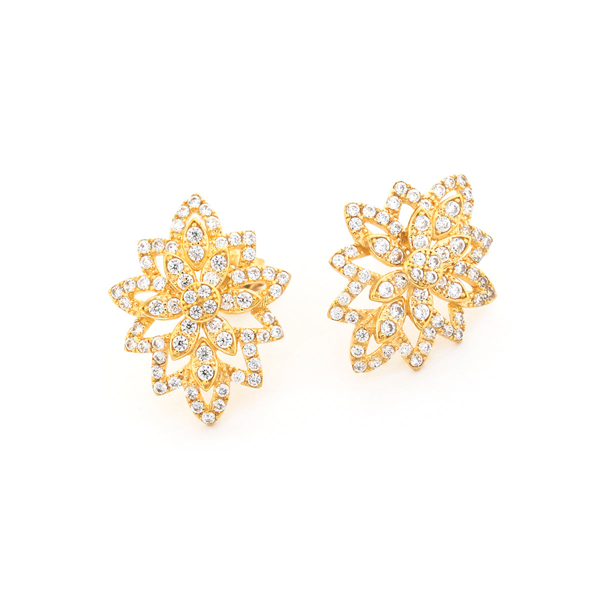 Gold floral earrings with clear gemstones on a white background