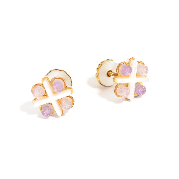 Pair of earrings with gold and pink gemstone design on a white background