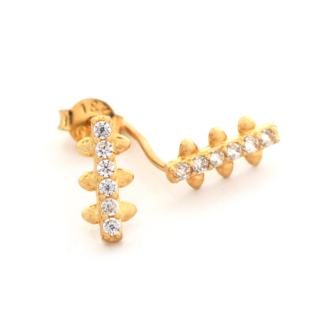 Gold earrings with diamond accents on a white background