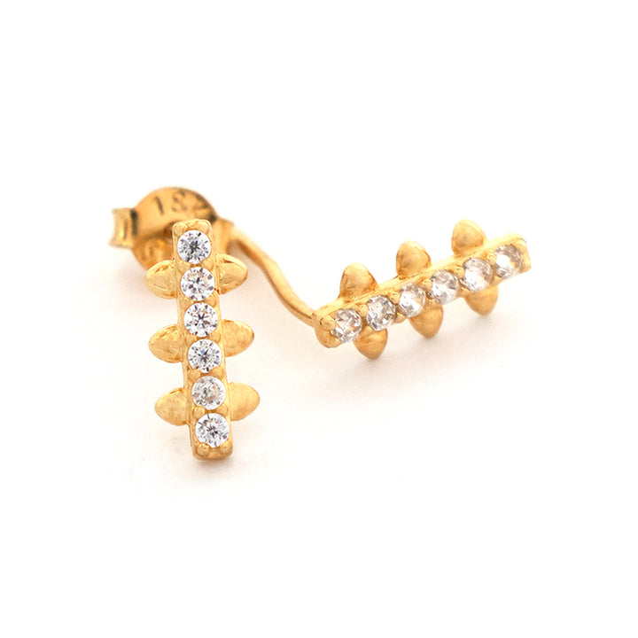 Gold earrings with diamond accents on a white background