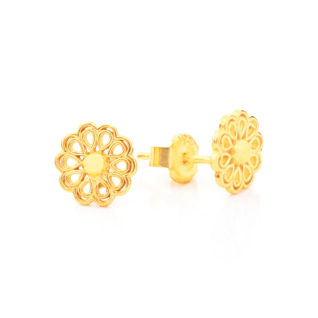 A pair of gold flower-shaped stud earrings with intricate cutout detailing, shown on a clean white background.