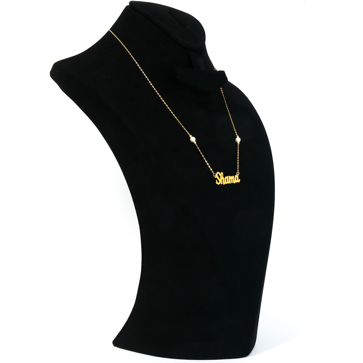 Black mannequin bust with a gold necklace on a white background