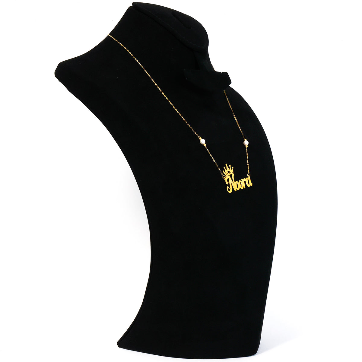 Gold necklace with a pendant on a black mannequin bust against a white background