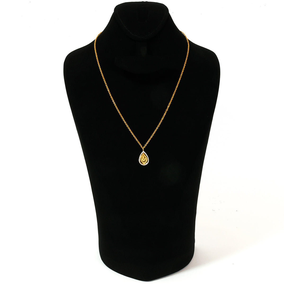 Gold necklace with a teardrop pendant on a black mannequin bust against a white background