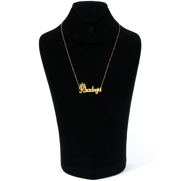 Gold necklace with 'Rhadeezi' pendant on a black mannequin bust.