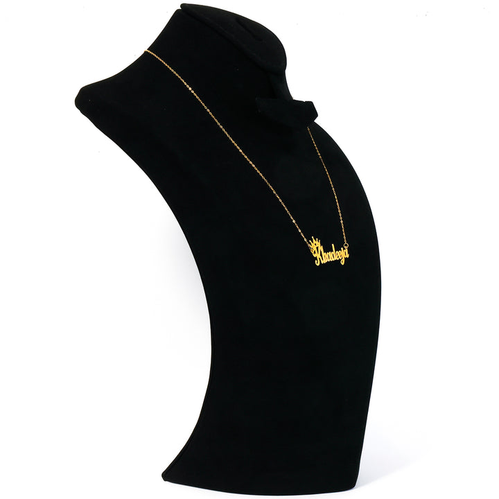 Black high-neck garment with gold embroidery on a white background