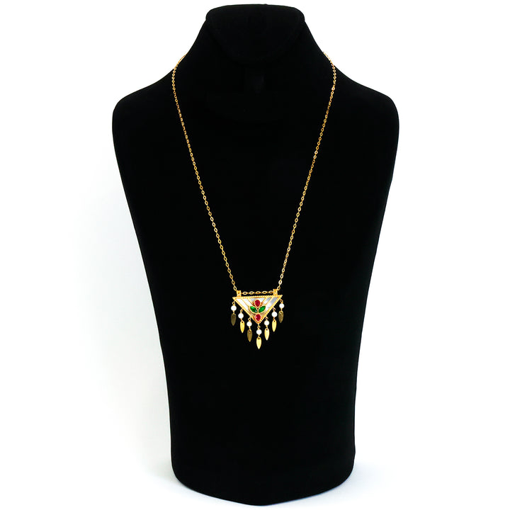 Gold necklace with a pendant on a black mannequin bust against a white background