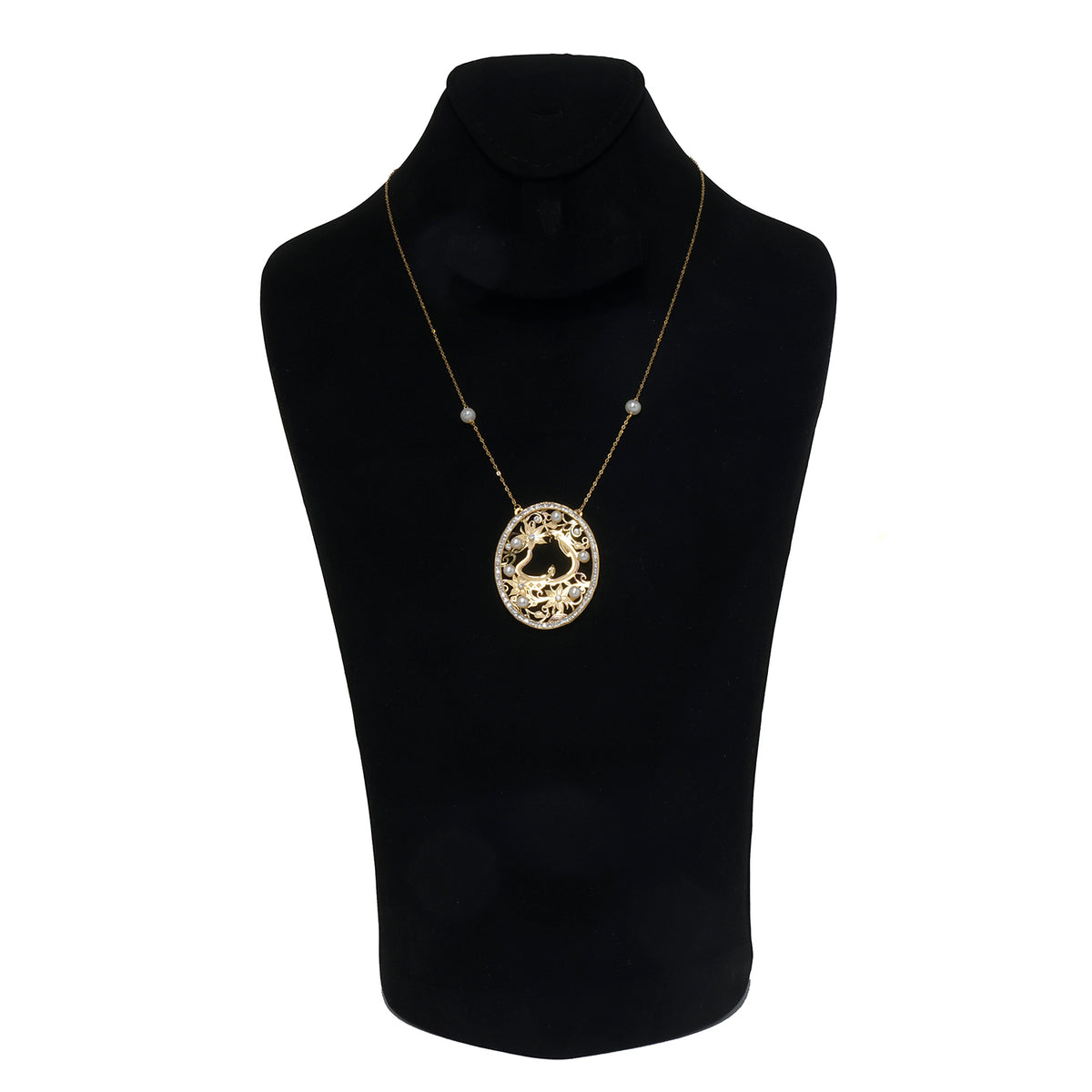 Gold necklace with a circular pendant on a black mannequin bust.
