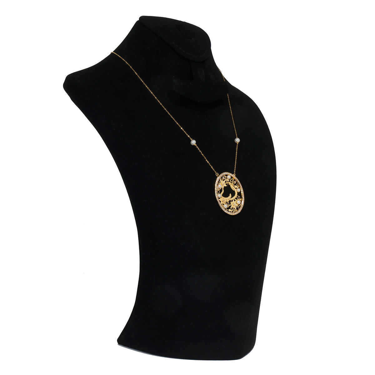 Gold necklace with a pendant on a black mannequin bust against a white background