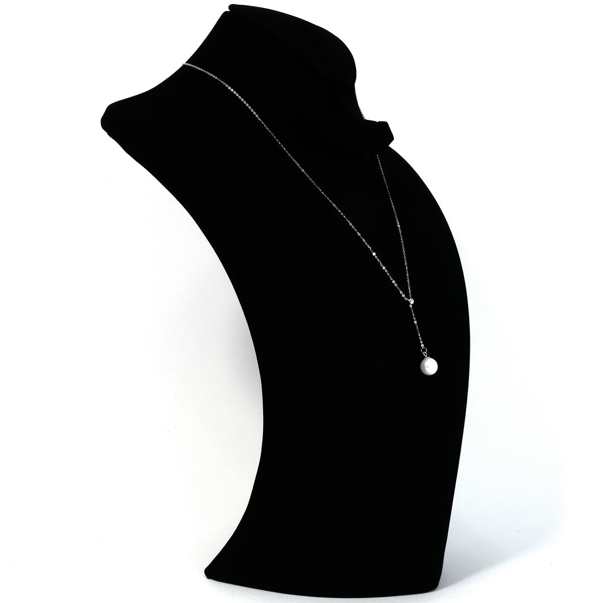 Black mannequin neck with a necklace on a white background