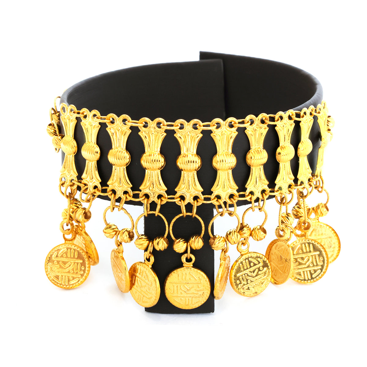 Gold bracelet with various charms on a black stand against a white background
