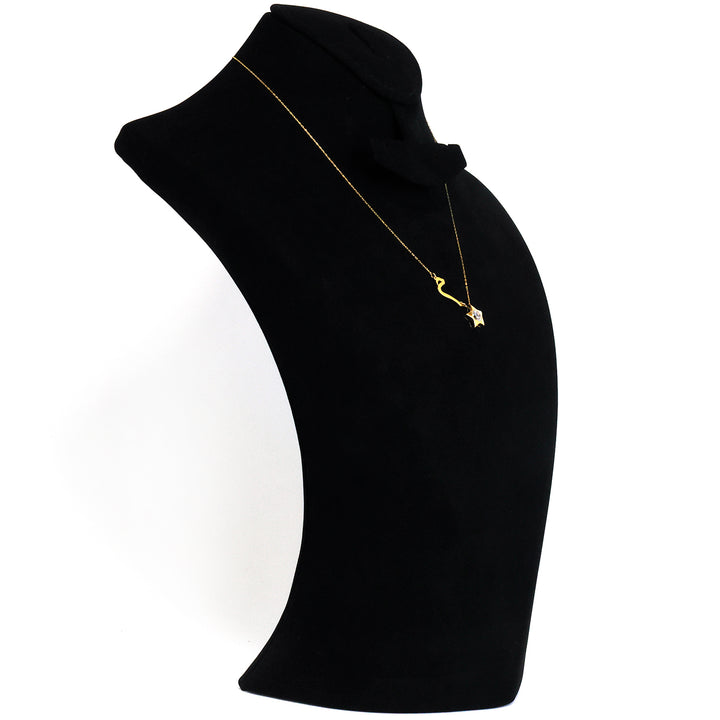 Gold necklace with a pendant on a black mannequin bust against a white background