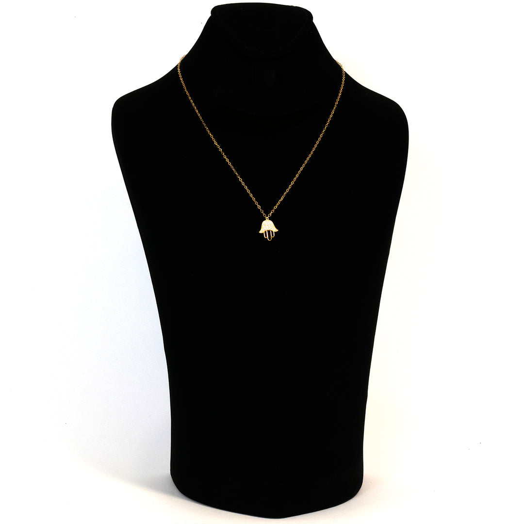 Gold necklace with a pendant on a black mannequin bust against a white background