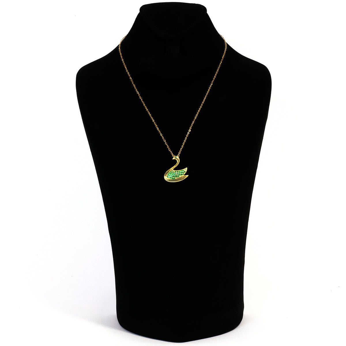 Gold necklace with a green pendant on a black mannequin bust.