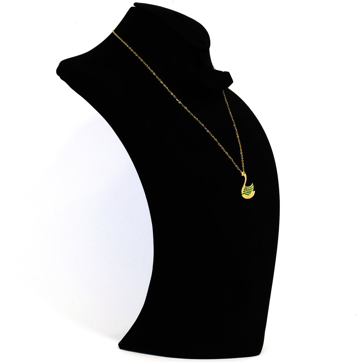 Black turtleneck sweater with a gold necklace on a white background