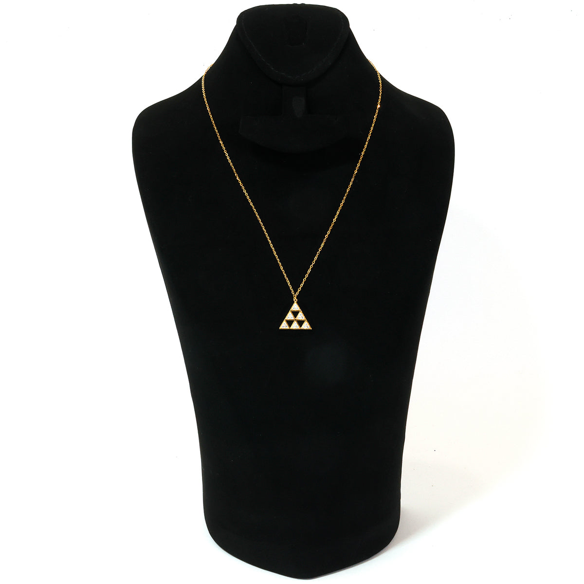 Gold necklace with a triangular pendant on a black mannequin bust.