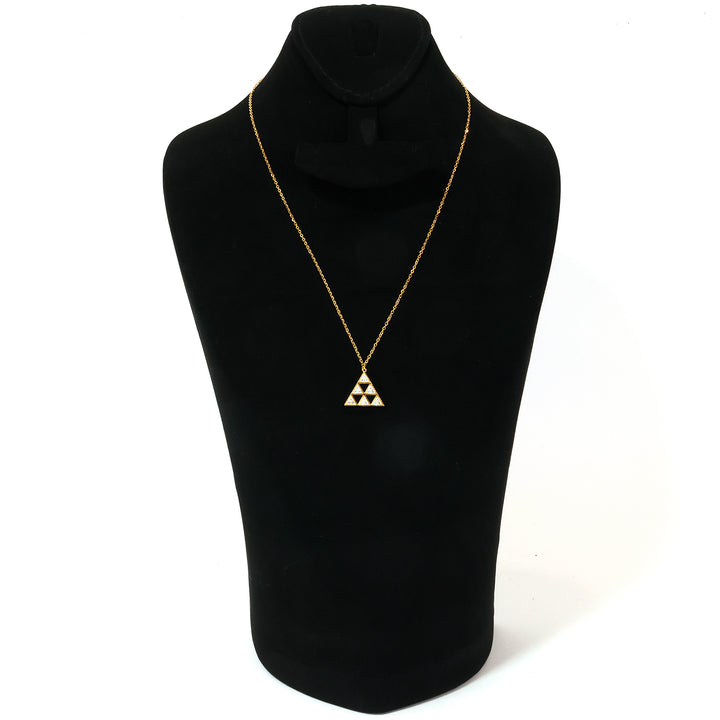 Gold necklace with a triangular pendant on a black mannequin bust.