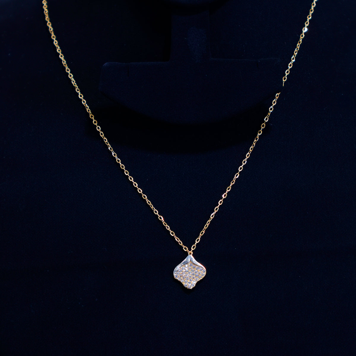 21K Gold Necklace – Sparkling pavé pendant in a soft four-petal silhouette – Close View