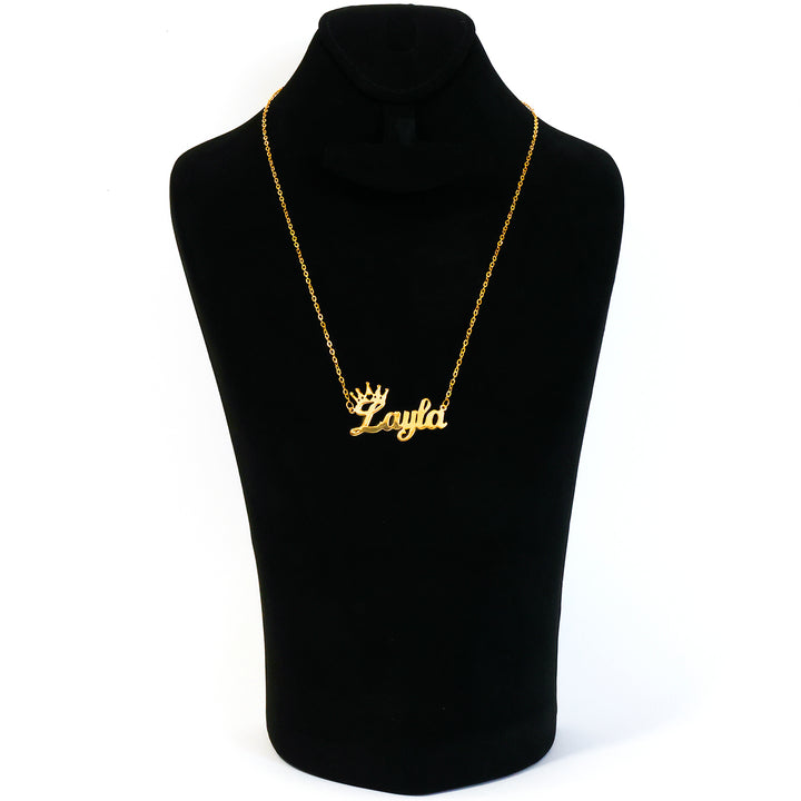 Gold necklace with 'Layla' pendant on a black mannequin bust.