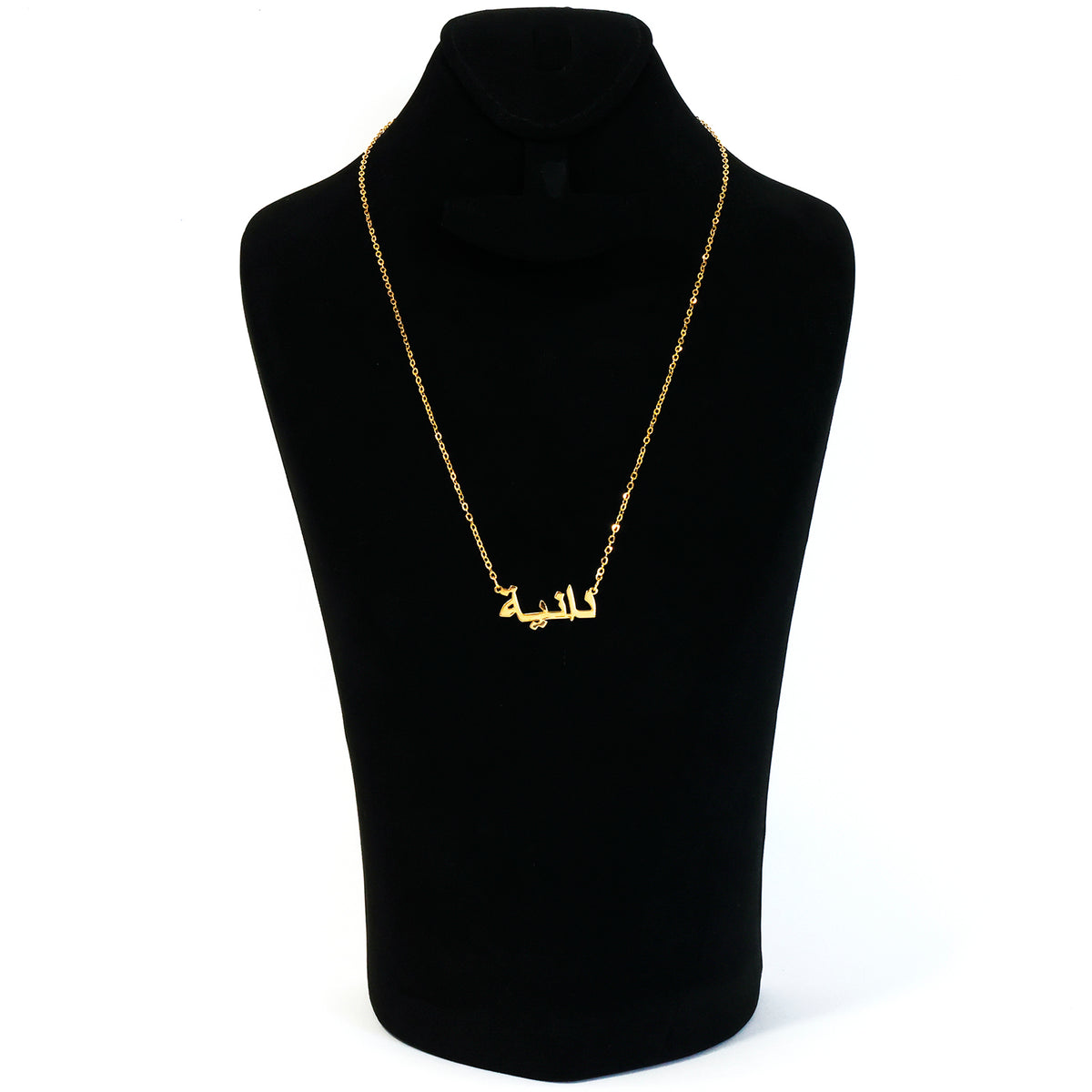 Black turtleneck sweater with a gold chain necklace on a mannequin against a white background