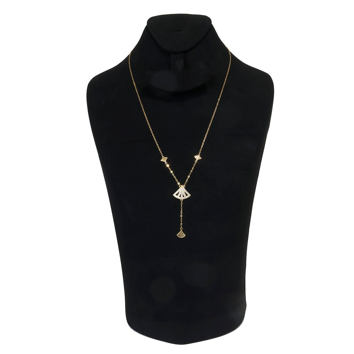 Gold necklace on a black mannequin bust with a white background