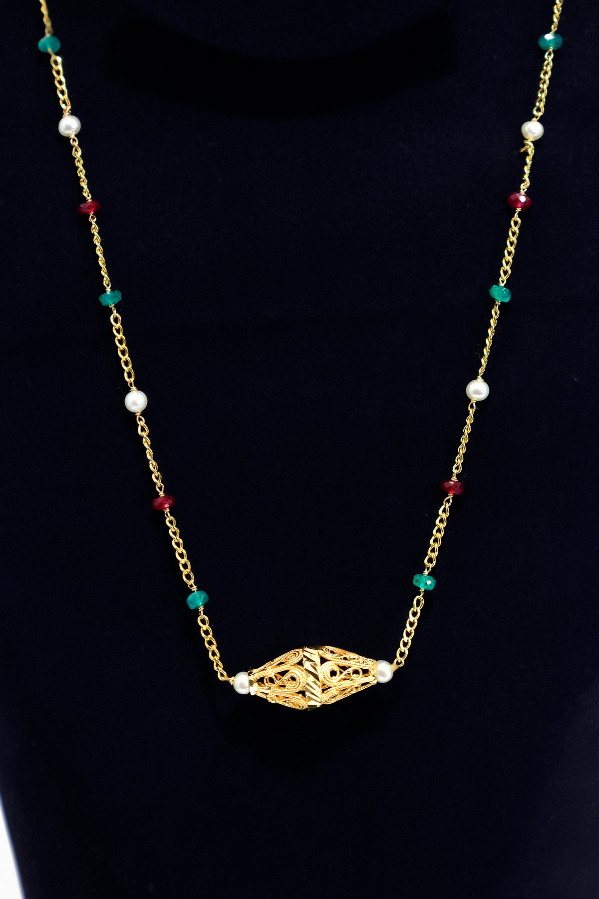 Gold necklace with decorative clasp on a black background Zero making charge 