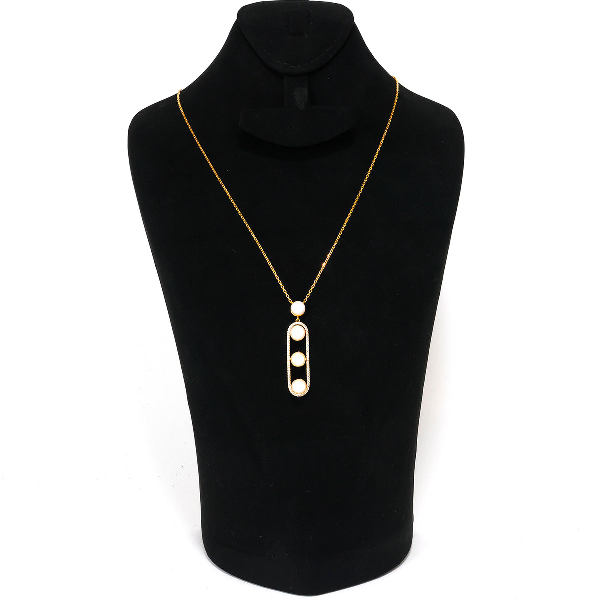 Gold necklace with a pendant on a black mannequin bust.