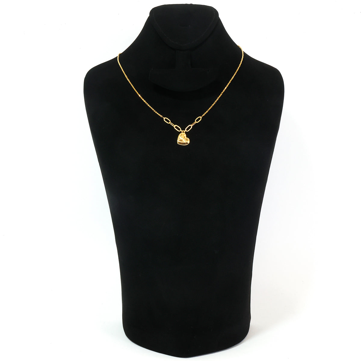 A gold chain necklace with a small bell-shaped pendant displayed on a black jewelry bust against a white background.