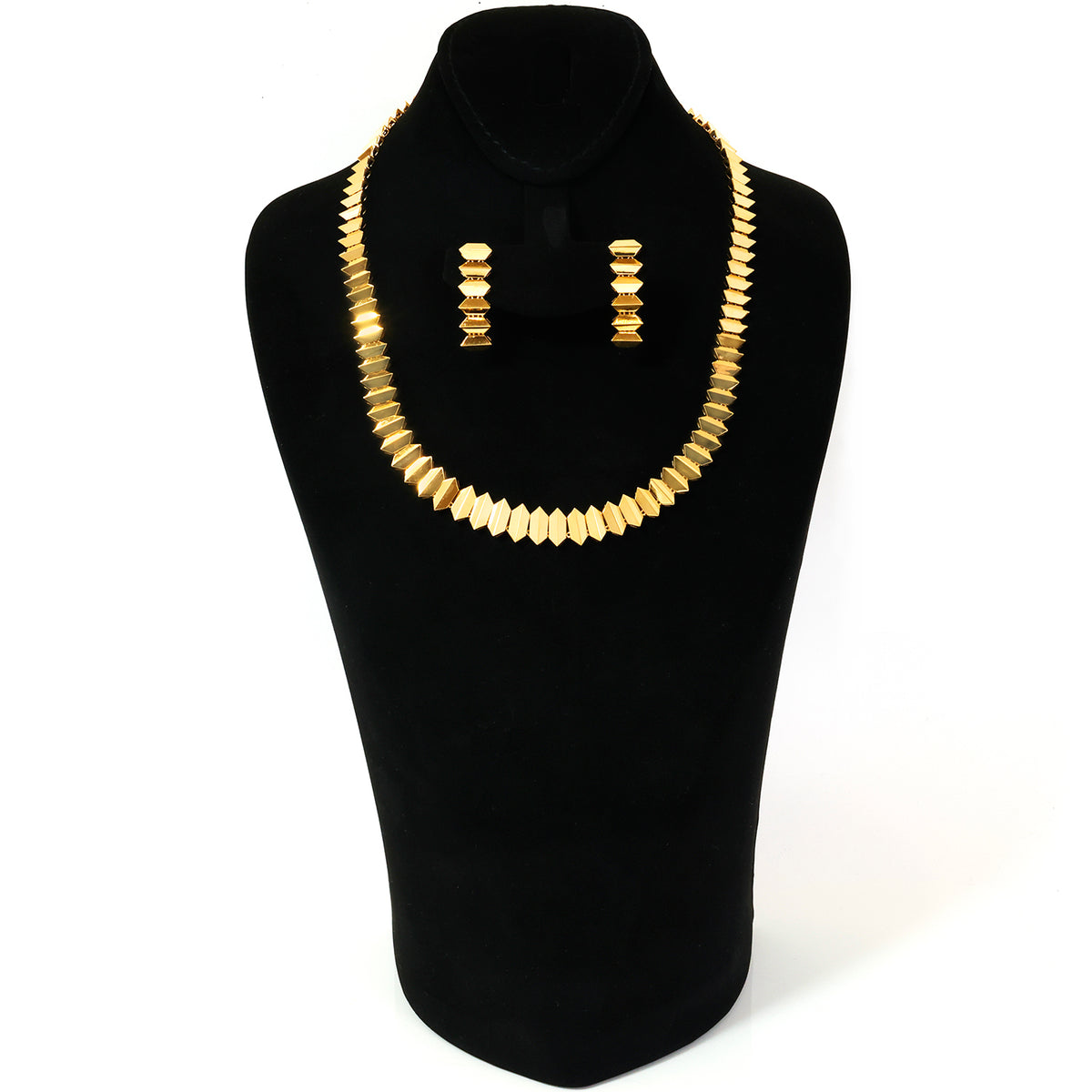 A gold-toned beaded necklace and matching drop earrings displayed on a black jewelry bust against a white background.
