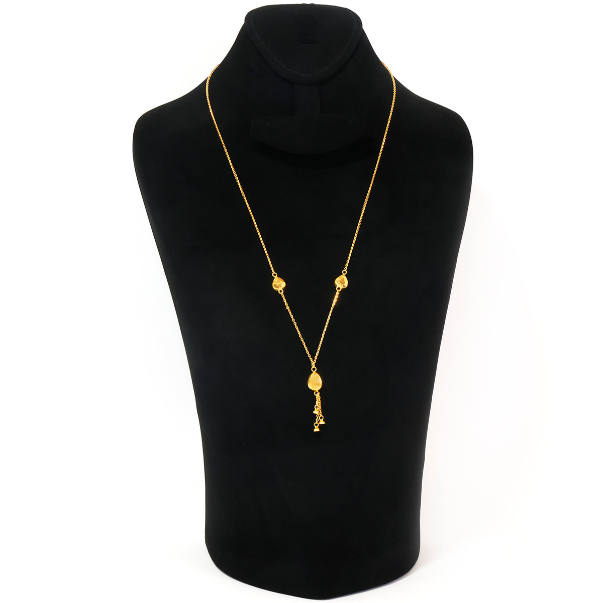 A gold necklace displayed on a black jewelry bust against a white background. The necklace features a delicate chain with small gold bead details and a dangling key-shaped pendant.