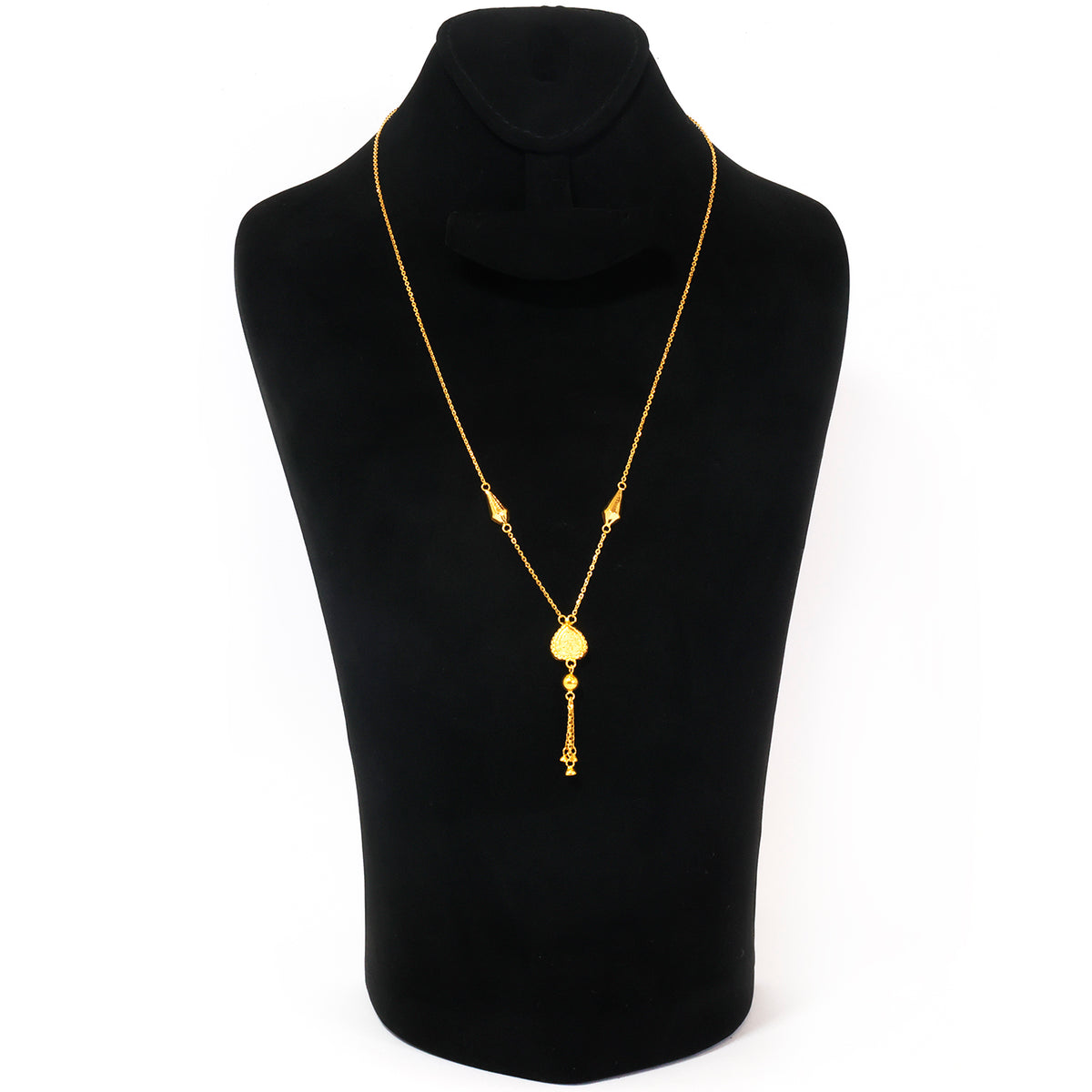 A gold-toned necklace displayed on a black jewelry bust against a plain white background.