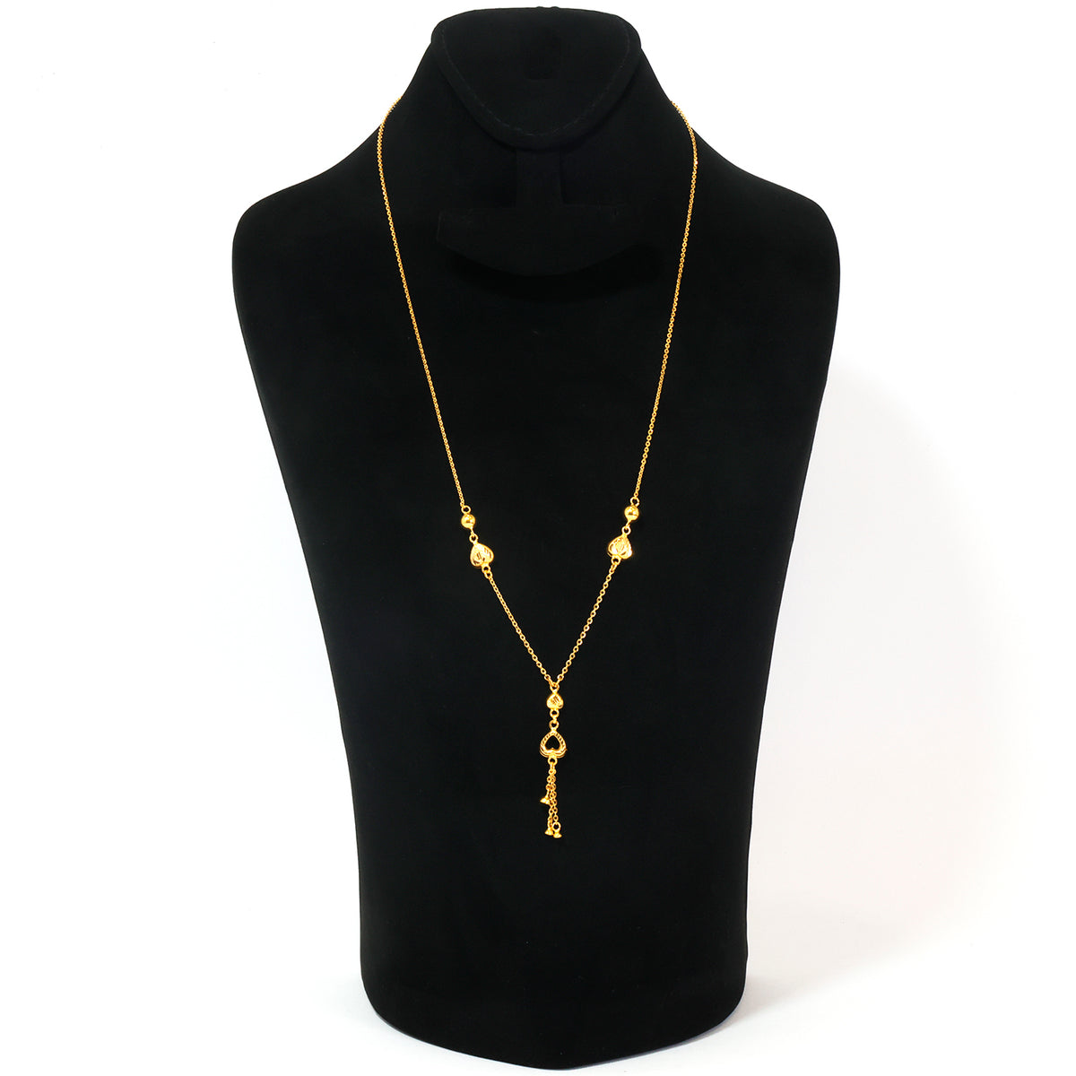 A gold necklace with a key pendant displayed on a black neck mannequin against a white background.