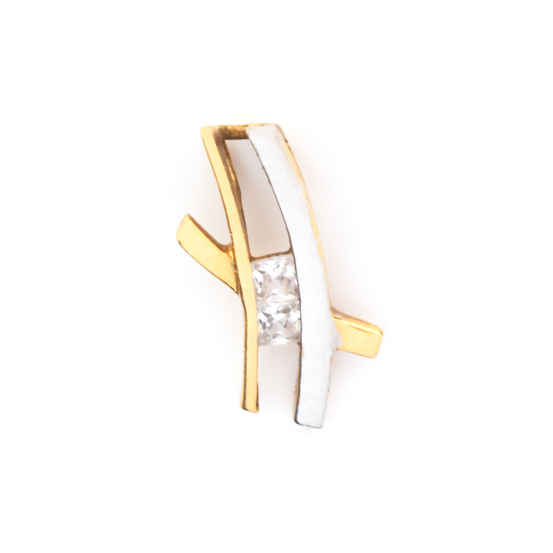 A two-tone gold and white gold ring featuring a central clear rectangular gemstone, set against a plain white background.