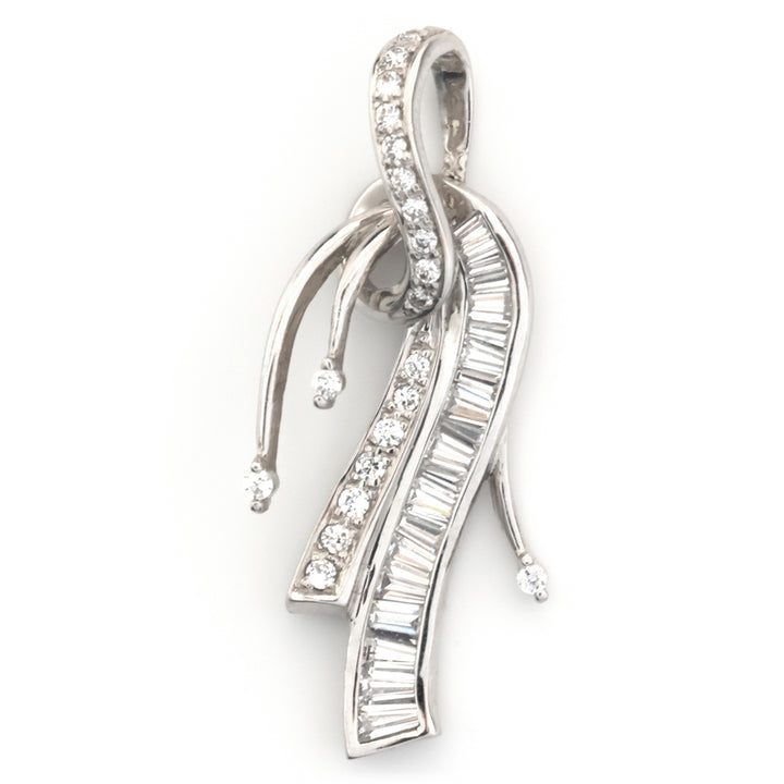 A silver-toned pendant featuring multiple flowing, ribbon-like curved elements set with clear baguette and round-cut gemstones, shown on a plain white background.