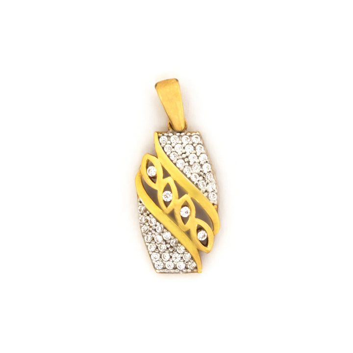 Gold and silver pendant with intricate design on a white background
