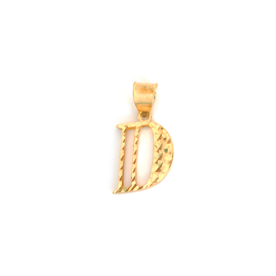 A gold initial pendant shaped like the letter &