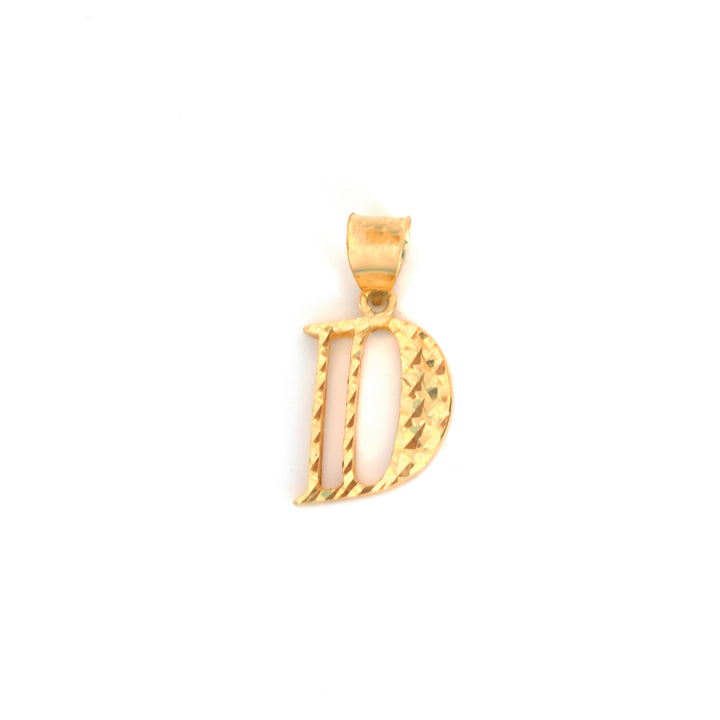 A gold initial pendant shaped like the letter &