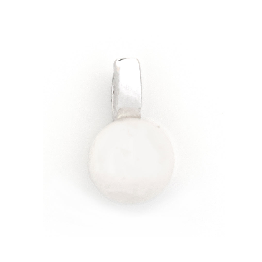 A silver pendant with a flat, circular white stone or cabochon setting, shown against a plain white background.