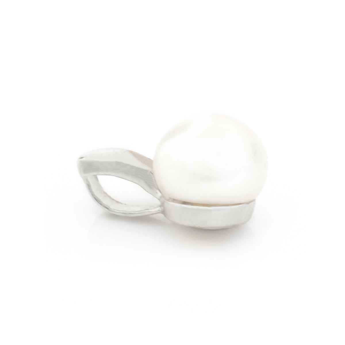 A silver ring featuring a large, round white pearl set in a polished silver bezel with a curved, openwork side band, shown on a plain white background.